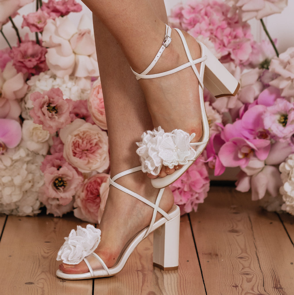 Charlotte Mills Nelly Flower Corsage Bridal Sandal with Criss-Cross Straps and pearl details.